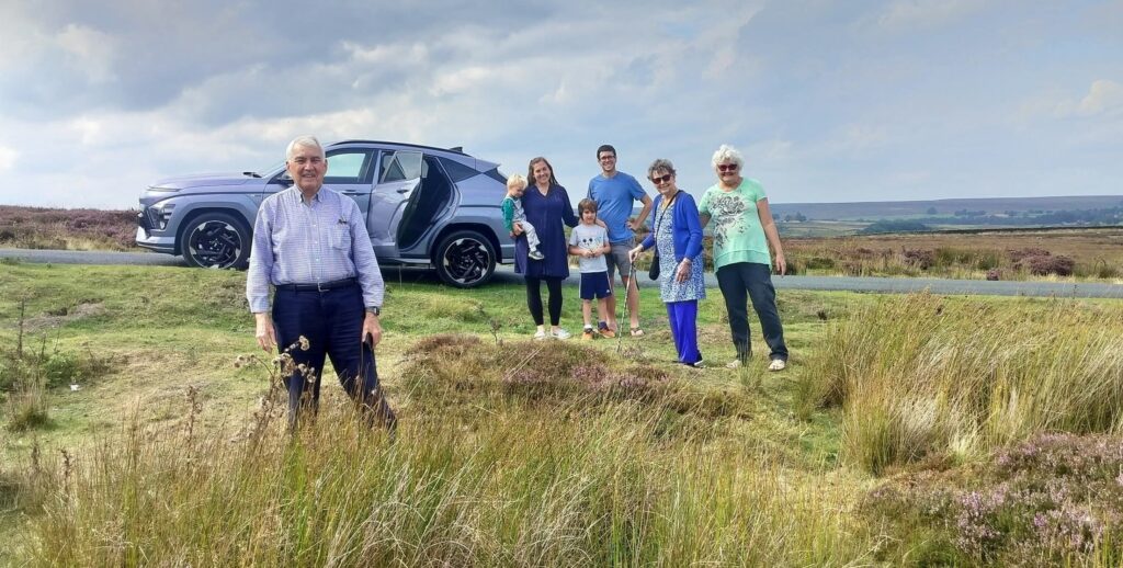 Jacki and her family alongside a road in Darley, UK