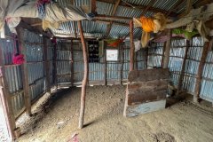 An existing dirt floor in one of the homes.