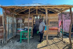 Pastor Jack visiting one of the homes in Batey Algodón that will receive a new floor.