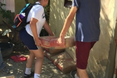 Carrying cement from the church